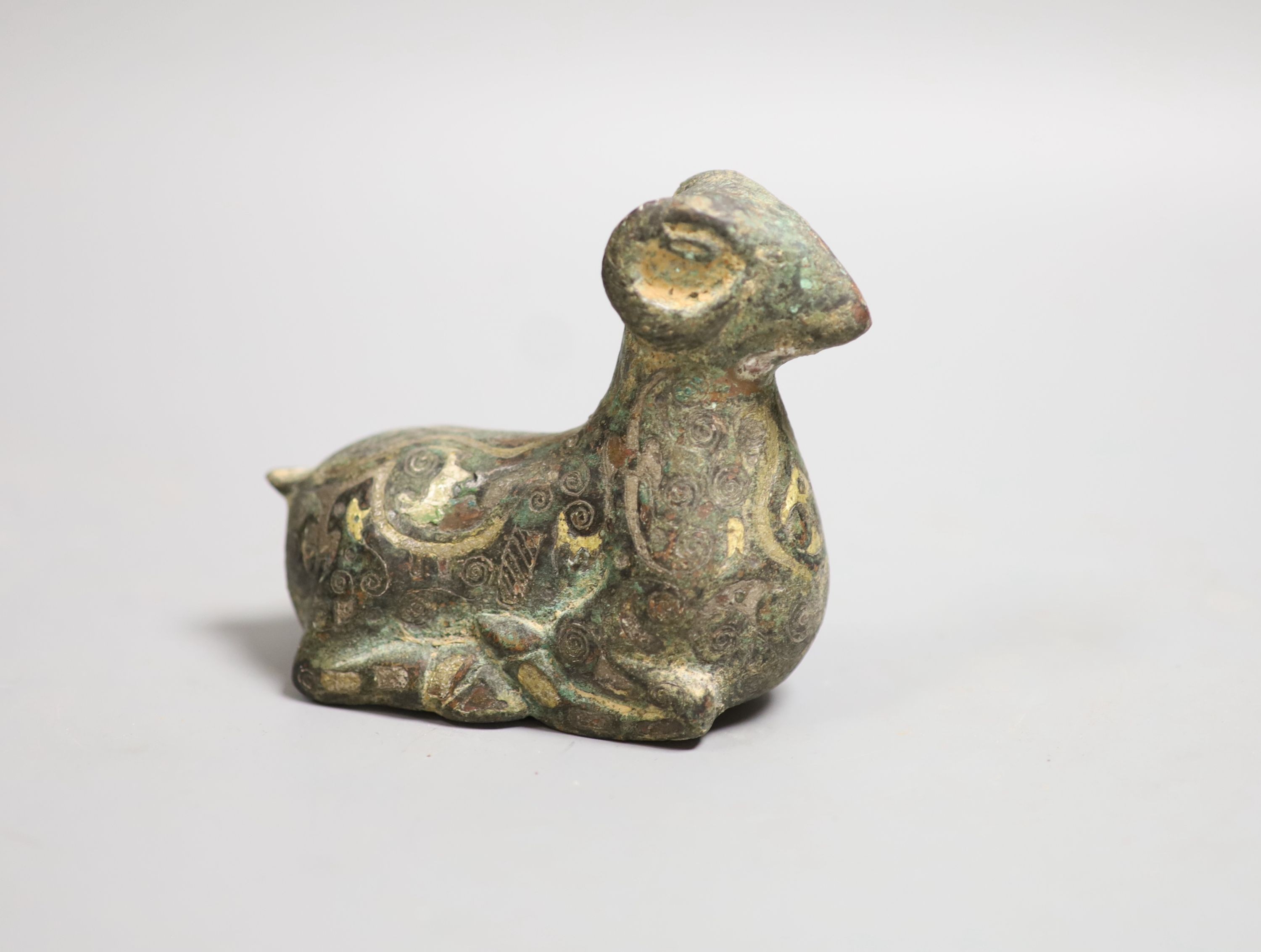 A Mongolian inlaid bronze ram, 9cm high